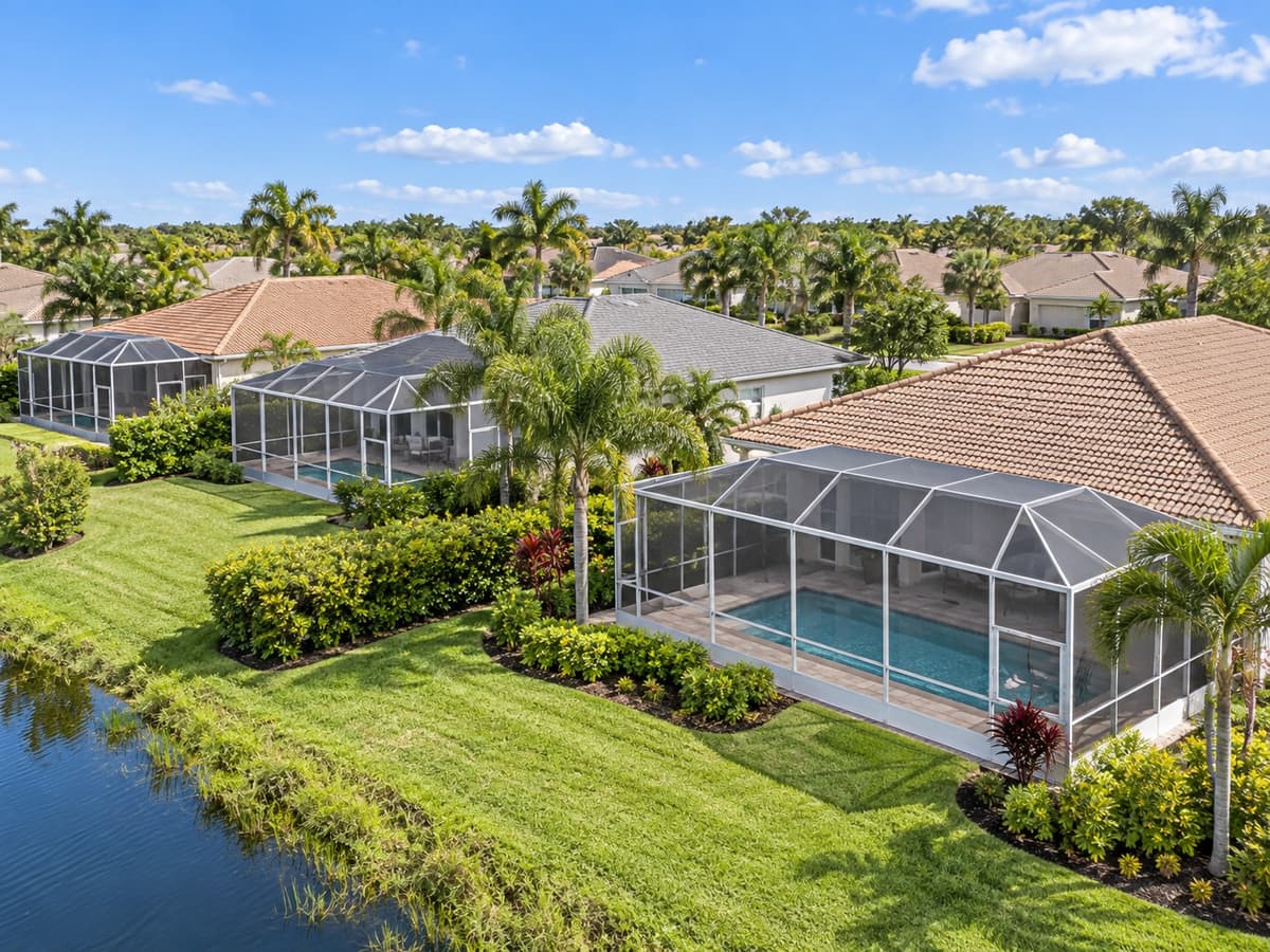 Aerial view of a Florida neighborhood with pool screen enclosures