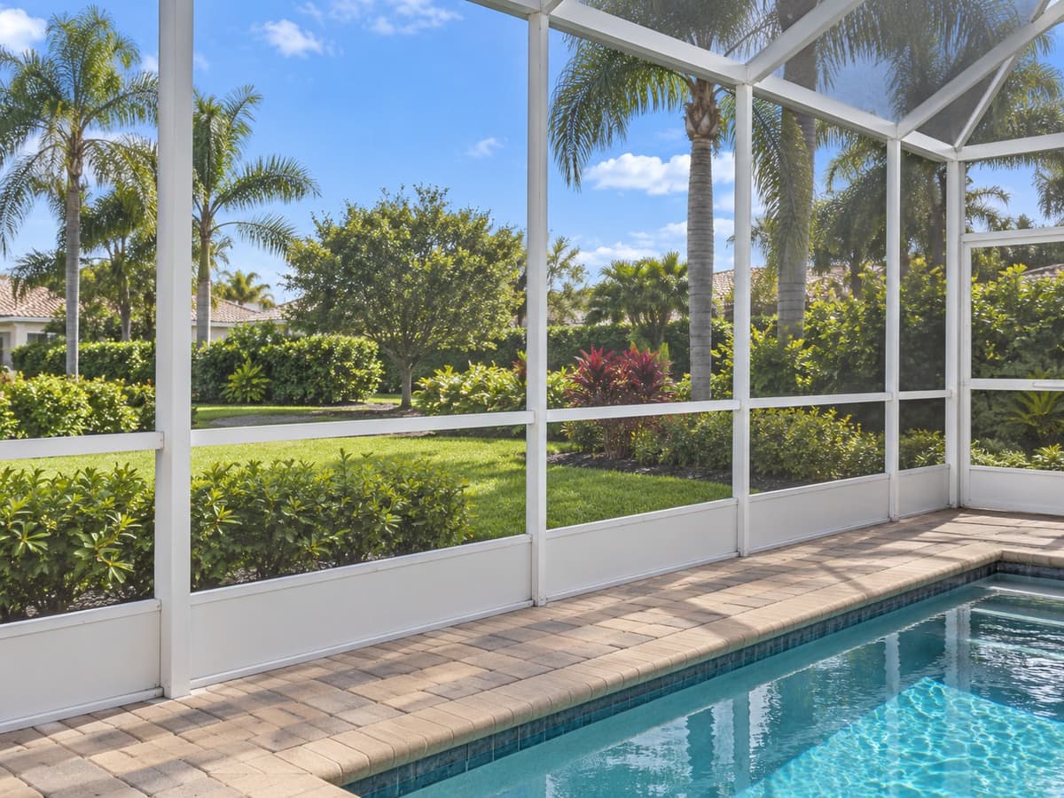 View from inside a Florida pool enclosure looking out through the screen