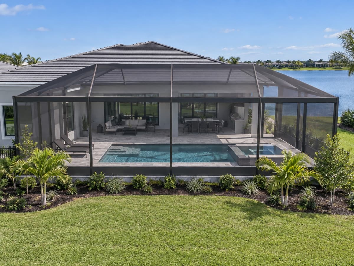 Newly installed pool enclosure with a dark aluminum frame
